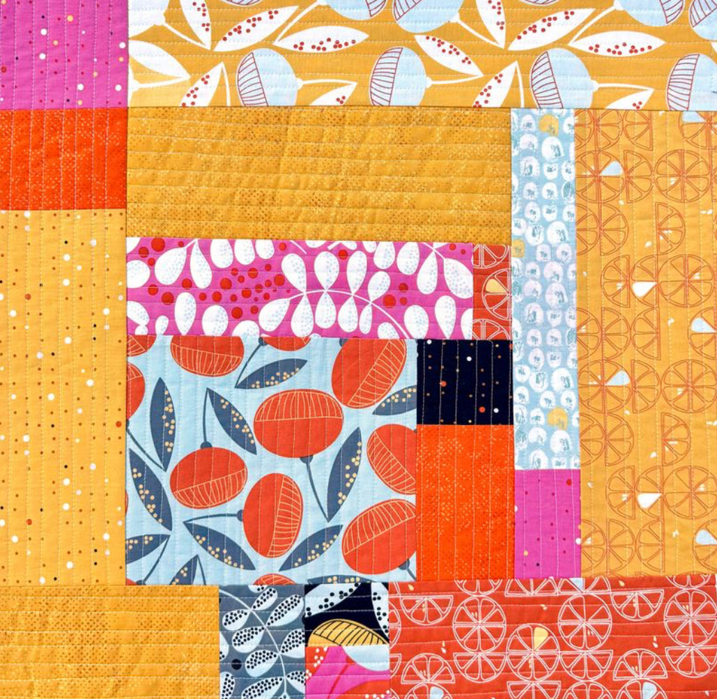 Colorful patchwork quilt using Bali inspired fabric from Zen chic for modern quilting ideas